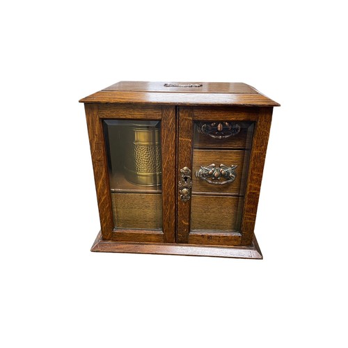 258 - Smokers cabinet with two bevelled glass doors, three internal drawers with brass drop handles, brass... 