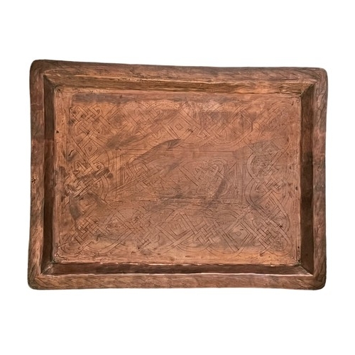 282 - A Nigerian hammered copper serving tray from Kano, inter-crossing pattern on surface with KANO Ostri... 