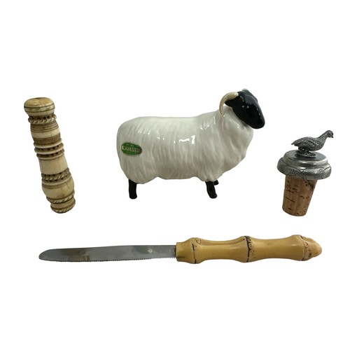 473 - Beswick black faced ram, bone needle case, bottle stopper and small knife.