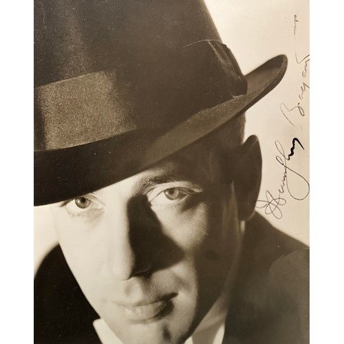 542 - Humphrey Bogart (1899-1957) – A framed black and white photograph signed by Humphrey Bogart in black... 