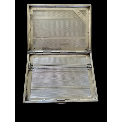 327 - A silver cigarette case with engine turned pattern, Birmingham hallmarks for 1920. Approx 98g. 11.3c... 