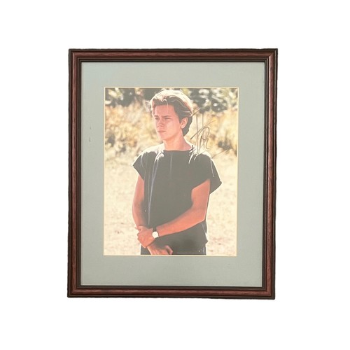 550 - River Phoenix (1970-1993) – A framed colour photograph signed by River Phoenix in black ink “River P... 