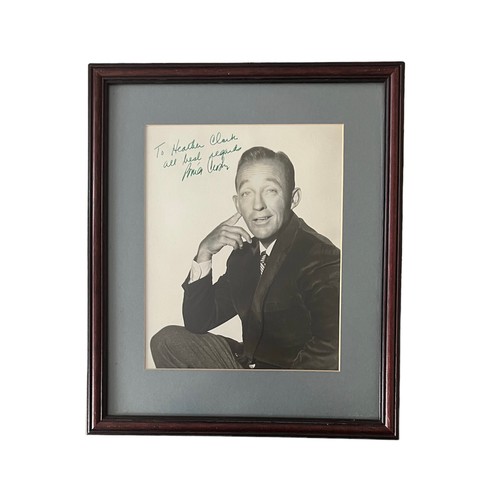 548 - Bing Crosby (1903-1977) – A framed black and white photograph signed by Bing Crosby in green ink “To... 