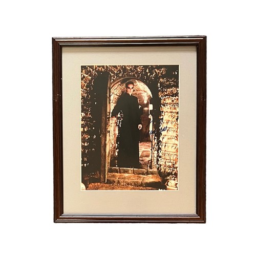 556 - The Matrix – Pair of framed signed photographs of characters from The Matrix to include; a colour ph... 