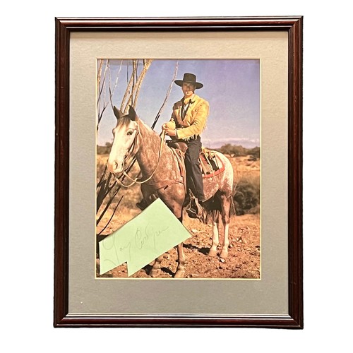 557 - Gary Cooper (1901-1961) – A framed colour photograph with hole removed for signature signed by Gary ... 