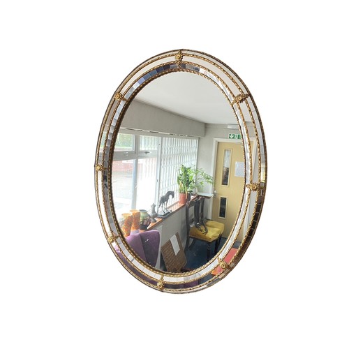 477 - Oval mirror with mirrored mosaic border, 78cm x 59cm.