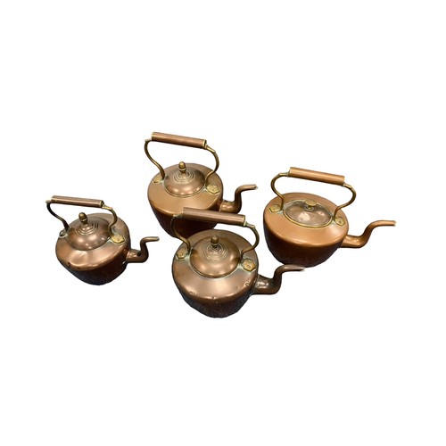 335 - Four vintage copper kettles.