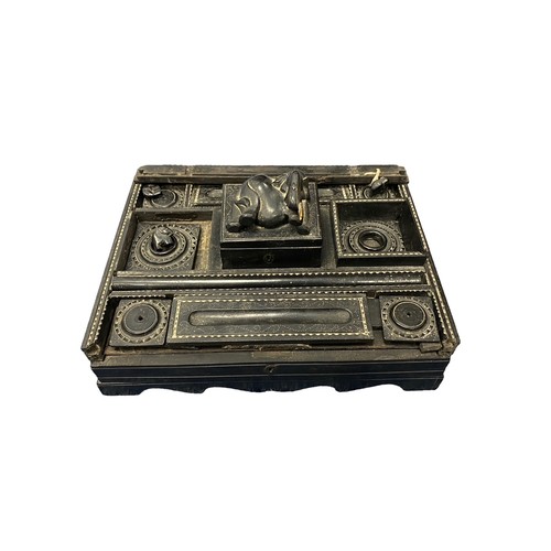 372 - An Eastern ebonised desk/ink stand.