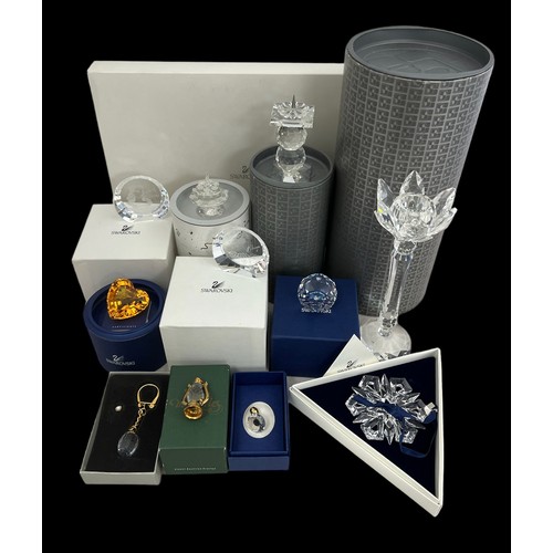 240 - A number of Swarovski crystal items. Includes 2 candleholders  (7600 NR 137 000, and 7600 NR 109 000... 