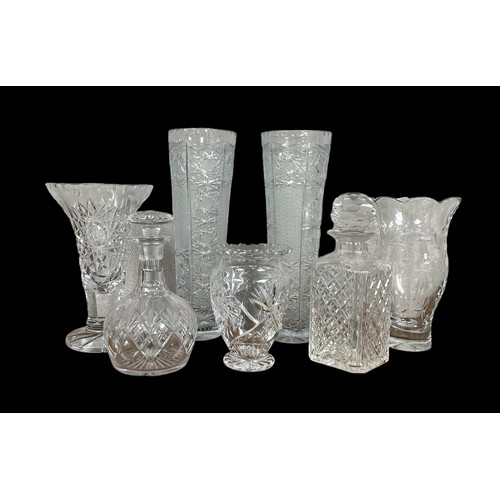 301 - Range of glass decanters (2) 23cm and 26cm tall, and vases (5) from 17cm to 36cm. Qty 7 items