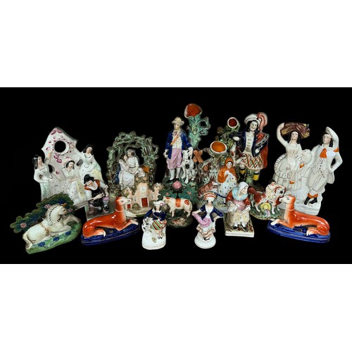 478 - A range of Staffordshire and similar, mainly flat back, figures to include 