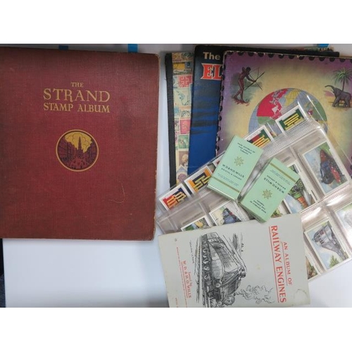 572 - World used collection in three old Schoolboy books, also Strand album with middle period used and sm... 