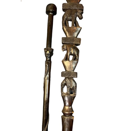 305 - Collection of twelve walking sticks, several with interesting carvings including an owl, African ani... 