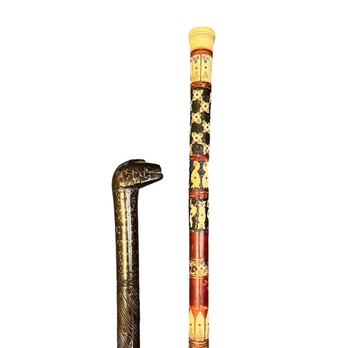 305 - Collection of twelve walking sticks, several with interesting carvings including an owl, African ani... 