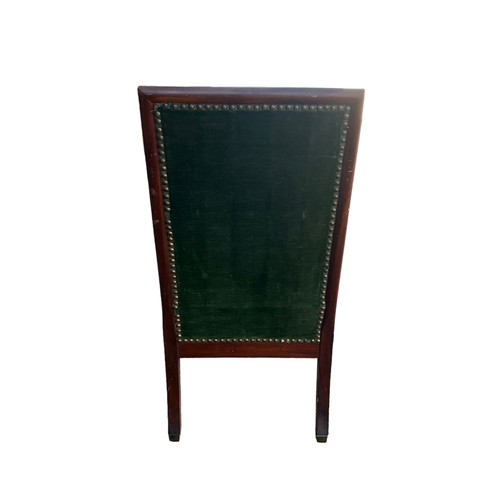 324 - Mahogany chair with kilim upholstery on turned legs with brass casters to front, height 87cm.