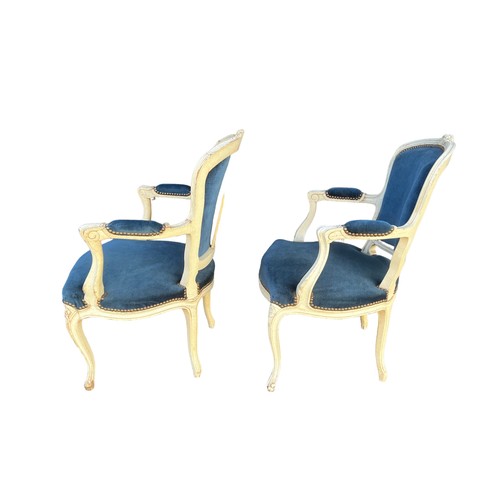 293 - A pair of French Louis XV style open arm salon chairs, carved frames painted white with cabriole fro... 