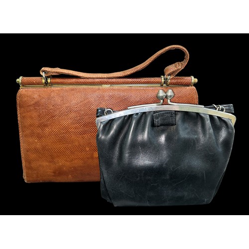 92 - A pair of vintage leather handbags, to include; a small black leather handbag with art deco style tw... 