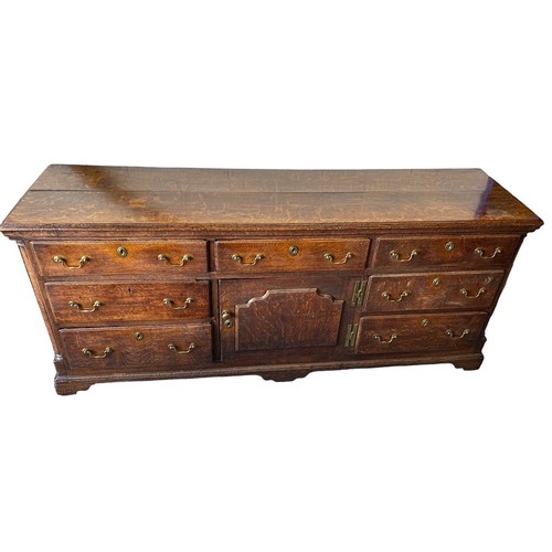 495 - Late 18th Century oak dresser base with central door with raised fielded panel, 7 working draws, ori... 