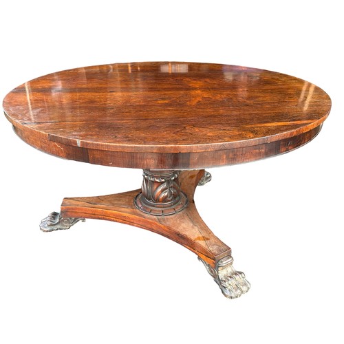 185 - Late Regency William IV rosewood breakfast table with triform base and paw feet. Diameter 130cm.