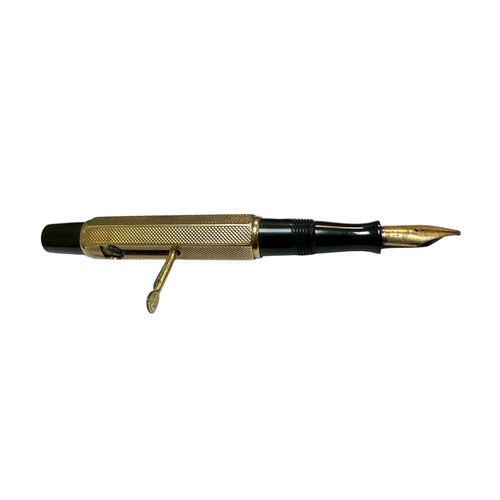 24 - A Waterman Ideal lever fill fountain pen with a 9ct engine turned gold cap and barrel cover having W... 