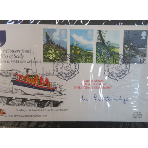 665 - A mixed lot to include; RNLI covers in small Royal National Life-Boat Institution albums (some signe... 