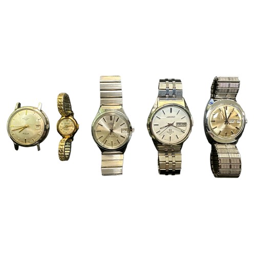 563 - Ladies and Gentlemen's watches to include a Timex 1976 day/ date watch, a Seiko 4004 day/ date gentl... 