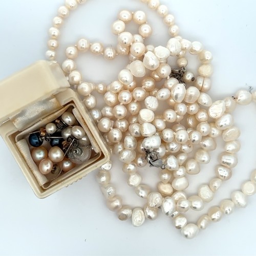 493 - Two cultured pearl necklaces with matching bracelets. Also several pairs of cultured pearl earrings.