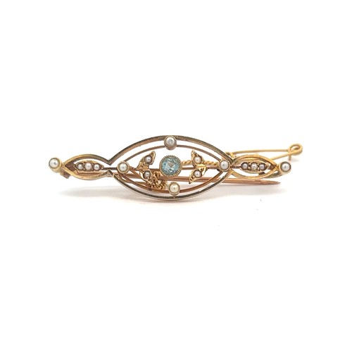 513 - An aquamarine and seed pearl brooch, stamped 15ct with a yellow metal pin attached. Weight approx 4.... 