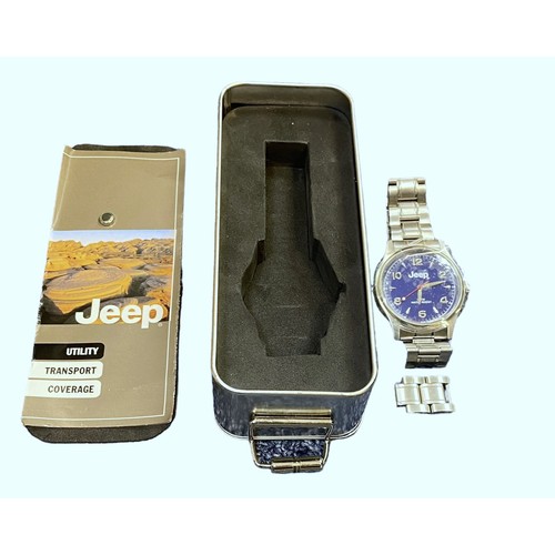 605 - A Jeep blue faced water resistant wristwatch with stainless steel strap. (2006). In Jeep metal tin w... 