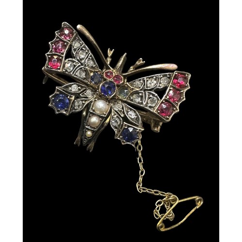 453 - A late Victorian butterfly brooch which can also be worn as a pendant. The butterfly has 3 split pea... 