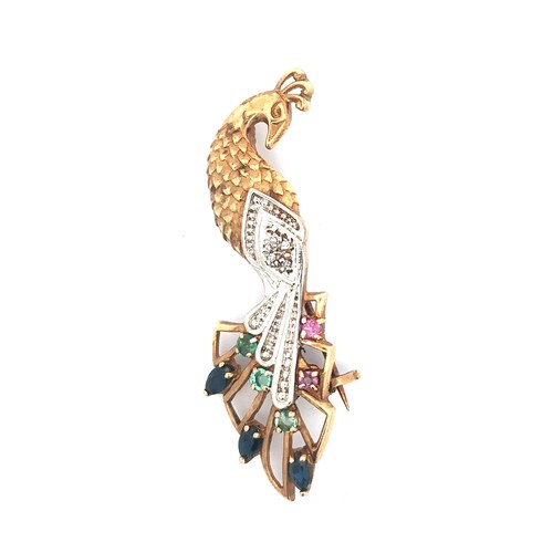 440 - A multi gemstone peacock brooch, the tail set with diamonds, rubies, sapphires and emeralds. Unmarke... 