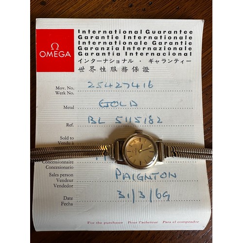 558 - Omega 9ct gold ladies wristwatch and bracelet, in branded box of issue with booklet/certificate date... 