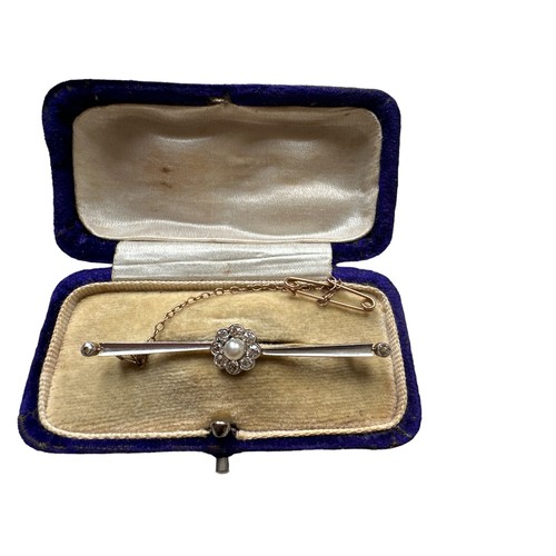 446 - A circa 1920 diamond and pearl cluster bar brooch set in unmarked gold and platinum, approx 54mm in ... 