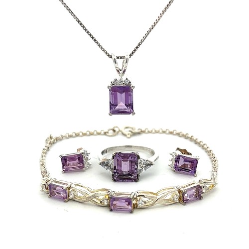 501 - A silver (stamped 925) and purple & white CZ set of matching jewellery items including a pendant nec... 