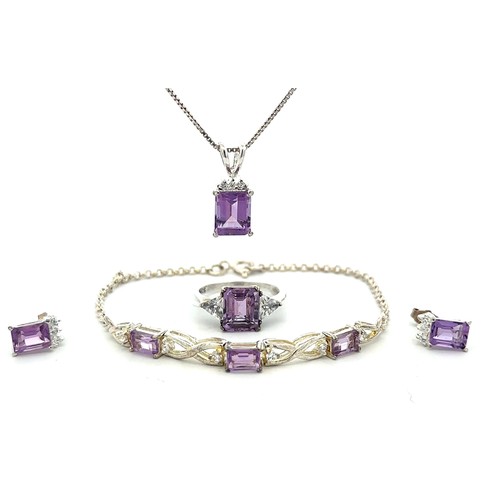 501 - A silver (stamped 925) and purple & white CZ set of matching jewellery items including a pendant nec... 