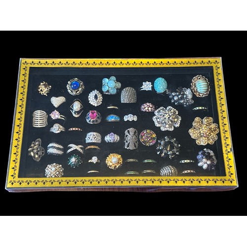 468 - A range of costume and silver rings, mainly between sizes L to P, some with adjustable bands.