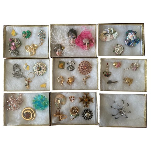 502 - A number of costume jewellery brooches.