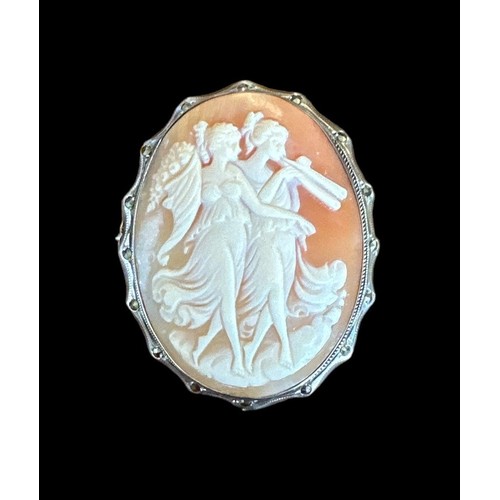 422 - Three shell cameo brooches, one with a 9ct gold mount and two with silver mounts.