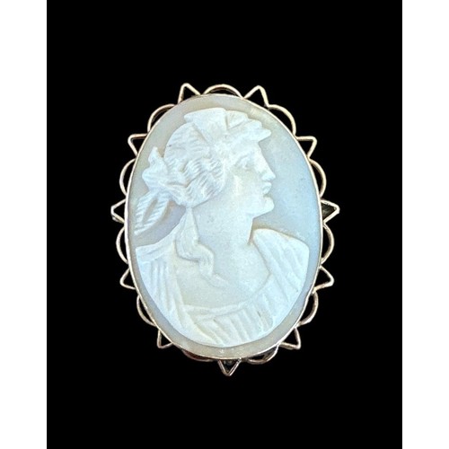 422 - Three shell cameo brooches, one with a 9ct gold mount and two with silver mounts.