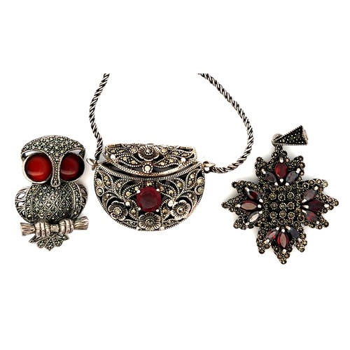 402 - Some marcasite and garnet jewellery including a white metal purse pendant with chain (small chip to ... 