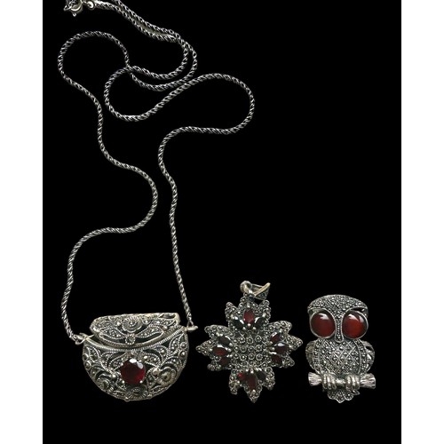 402 - Some marcasite and garnet jewellery including a white metal purse pendant with chain (small chip to ... 