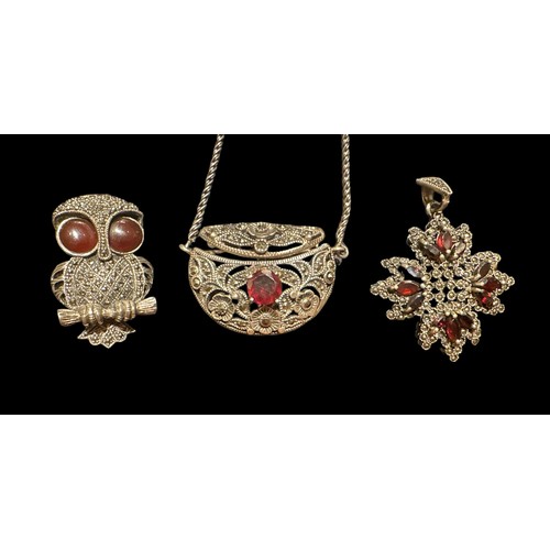 402 - Some marcasite and garnet jewellery including a white metal purse pendant with chain (small chip to ... 