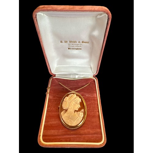 420 - A 9ct gold shell cameo depicting a lady in profile with flower in her hair, approx 38mm in length. C... 