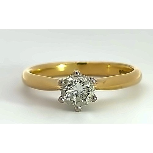 490 - A solitaire diamond 18ct gold ring. Diamond is lively and in good condition, approx 0.52ct and  SI2 ... 