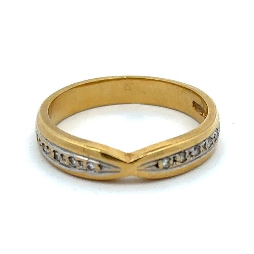 499 - An 18ct gold ring with diamond accents, size M. Weight 4.07g