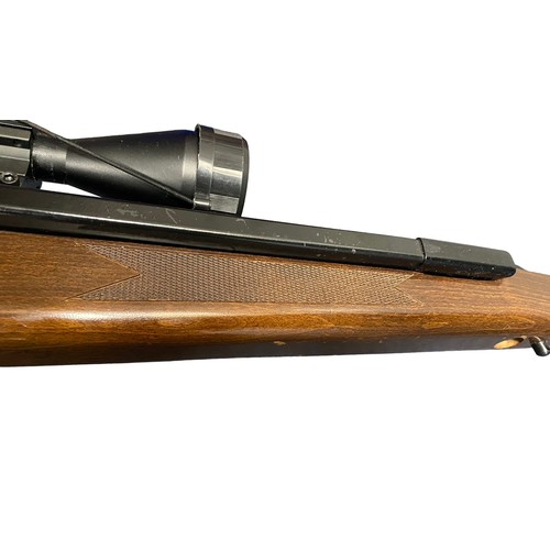 121 - Diana Mod 52 .22 side lever air rifle, serial number 973050, beech wood stock having chequered embos... 