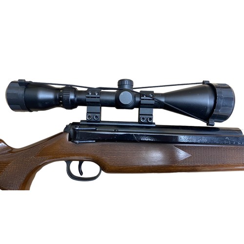 121 - Diana Mod 52 .22 side lever air rifle, serial number 973050, beech wood stock having chequered embos... 