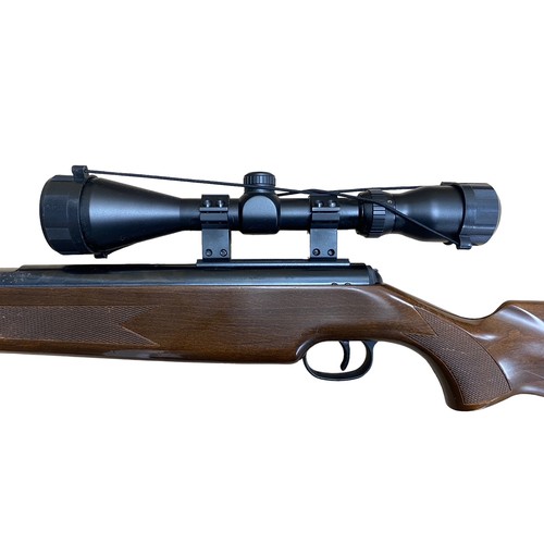 121 - Diana Mod 52 .22 side lever air rifle, serial number 973050, beech wood stock having chequered embos... 