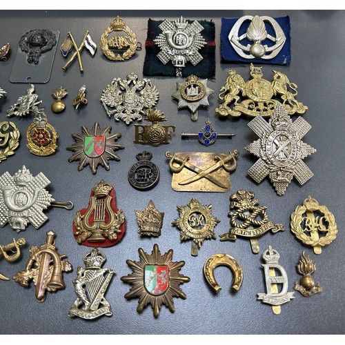 164 - Assortment of Cap Badges, some better, to include; Assaye (x2), Royal Army Service Corps, Lancastria... 