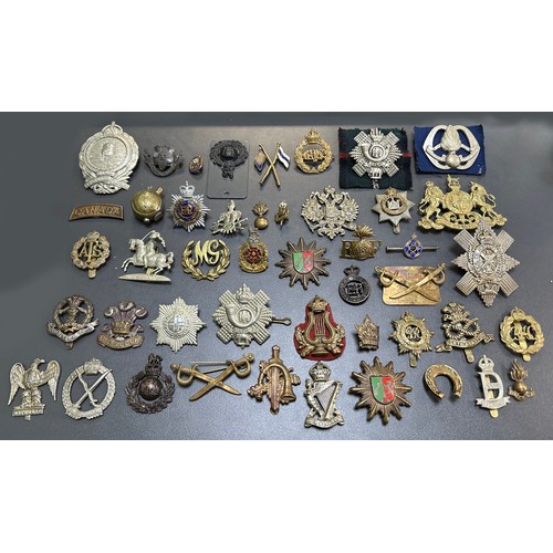 164 - Assortment of Cap Badges, some better, to include; Assaye (x2), Royal Army Service Corps, Lancastria... 